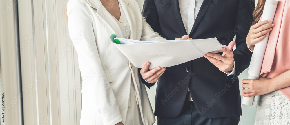 Businessman is in meeting discussion with colleague businesswomen in modern workplace office. People