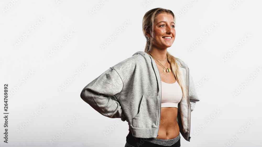 Athletic woman standing in workout clothes