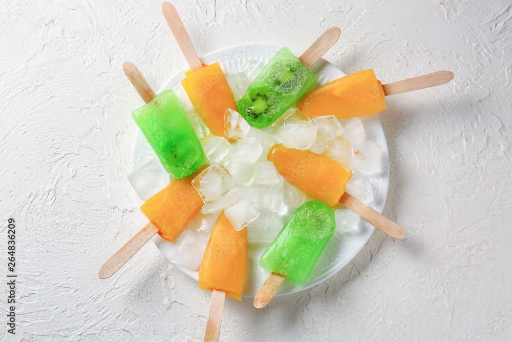 Plate with tasty ice cream on light background