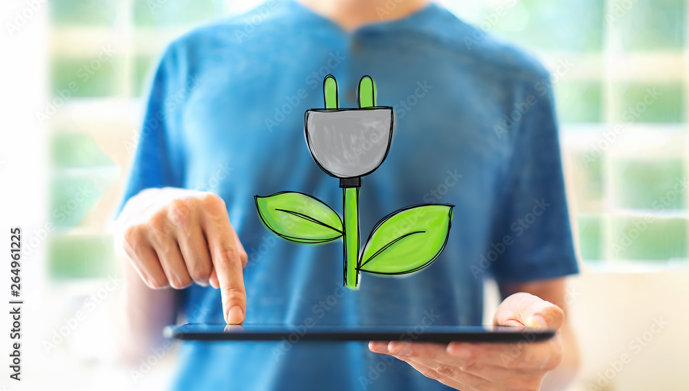 Eco plug with young man using a tablet computer