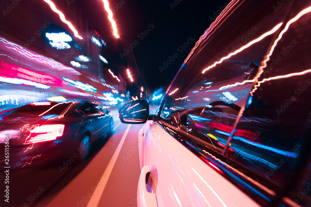 POV of car driving at night city with motion blur