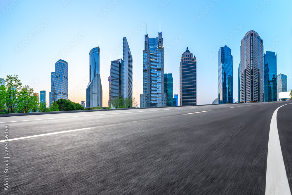 Motion blurred highway and skyline of modern urban buildings in Shanghai