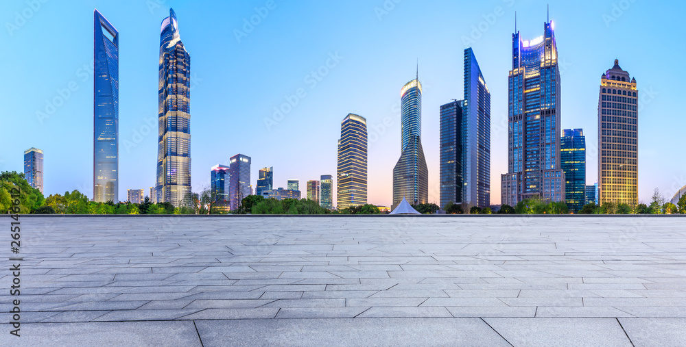 Shanghai modern commercial office buildings and square floor at night,panoramic view