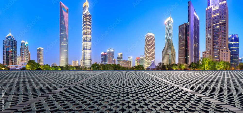 Shanghai modern commercial office buildings and square floor at night,panoramic view