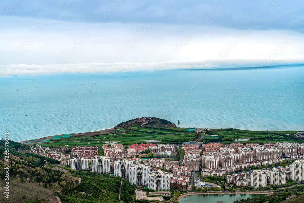 A birds eye view of Qingdao coastline and urban skyline..