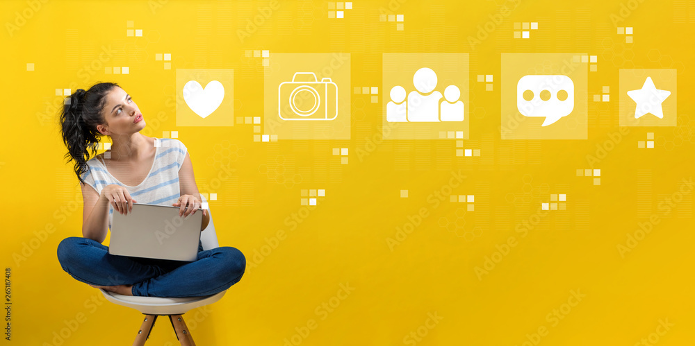 Social media with young woman using a laptop computer 