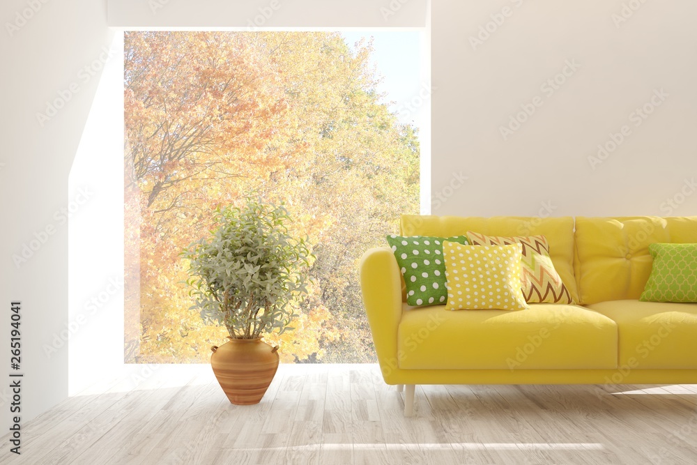 Stylish room in white color with sofa and autumn landscape in window. Scandinavian interior design. 