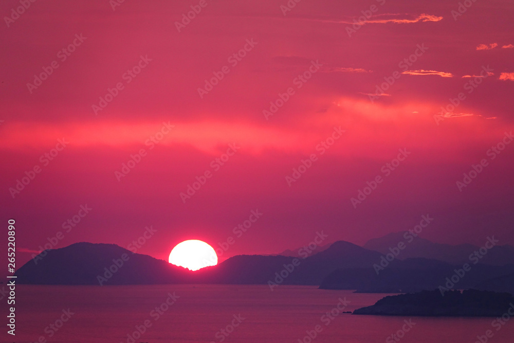 AERIAL: Colourful picture of a sundown producing vibrant colours in Croatia.