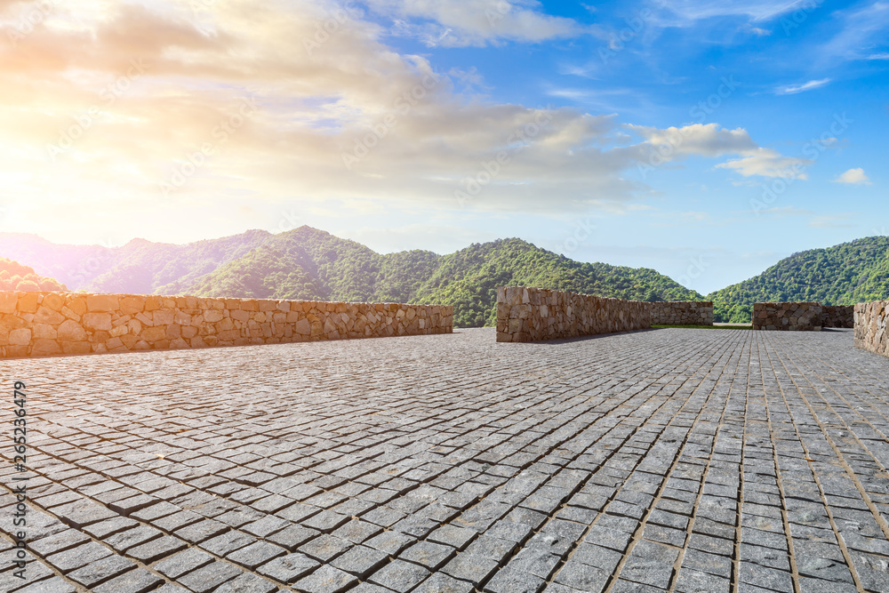 Empty floor and green mountain natural landscape at sunset