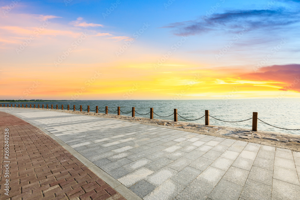 Beautiful lake and walkway with sky clouds at sunset