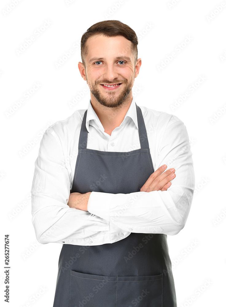 Handsome man in apron on white background