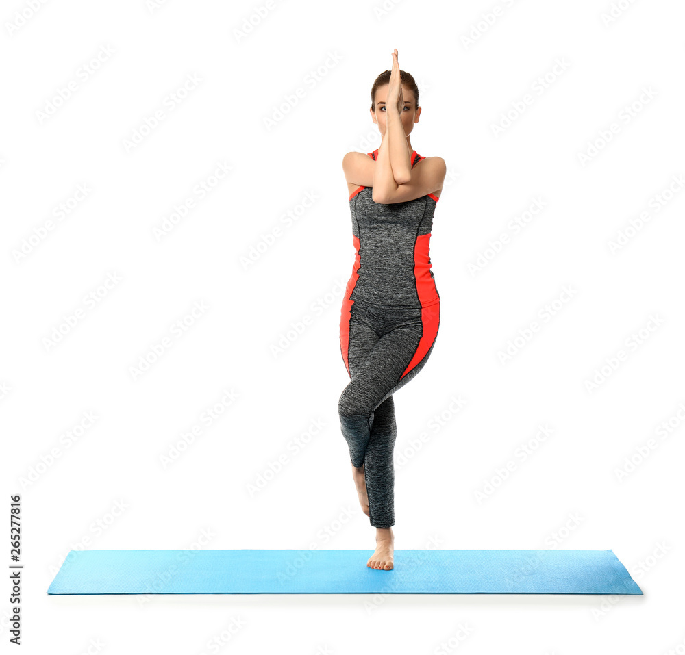 Sporty woman practicing yoga on white background