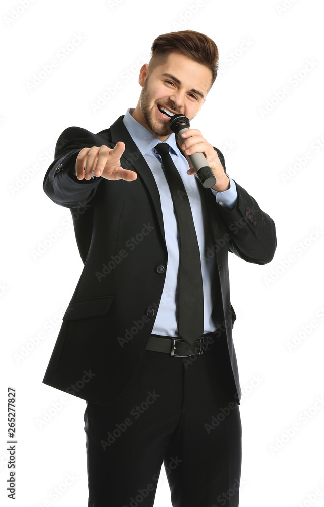 Handsome male singer with microphone on white background