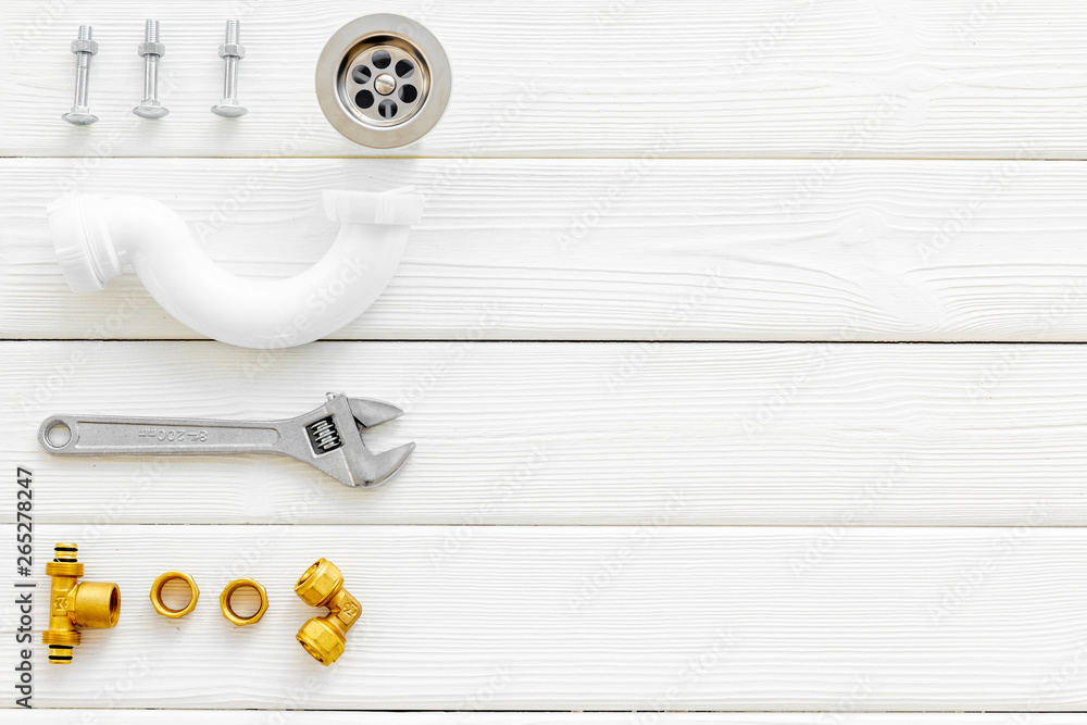 Professional instruments for plumber on white wooden background top view space for text