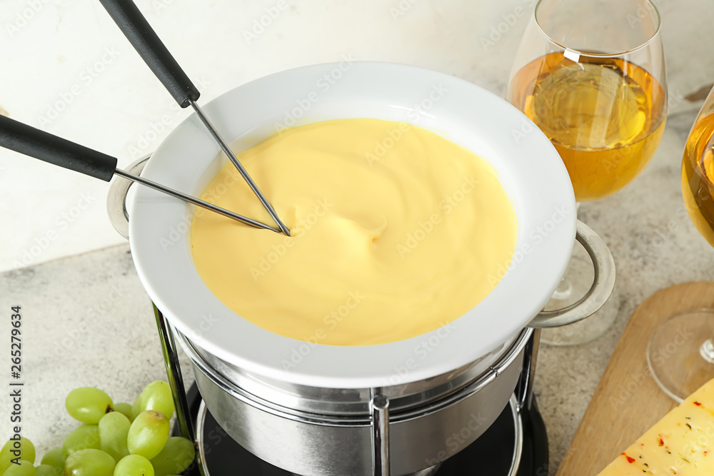 Cheese fondue on table