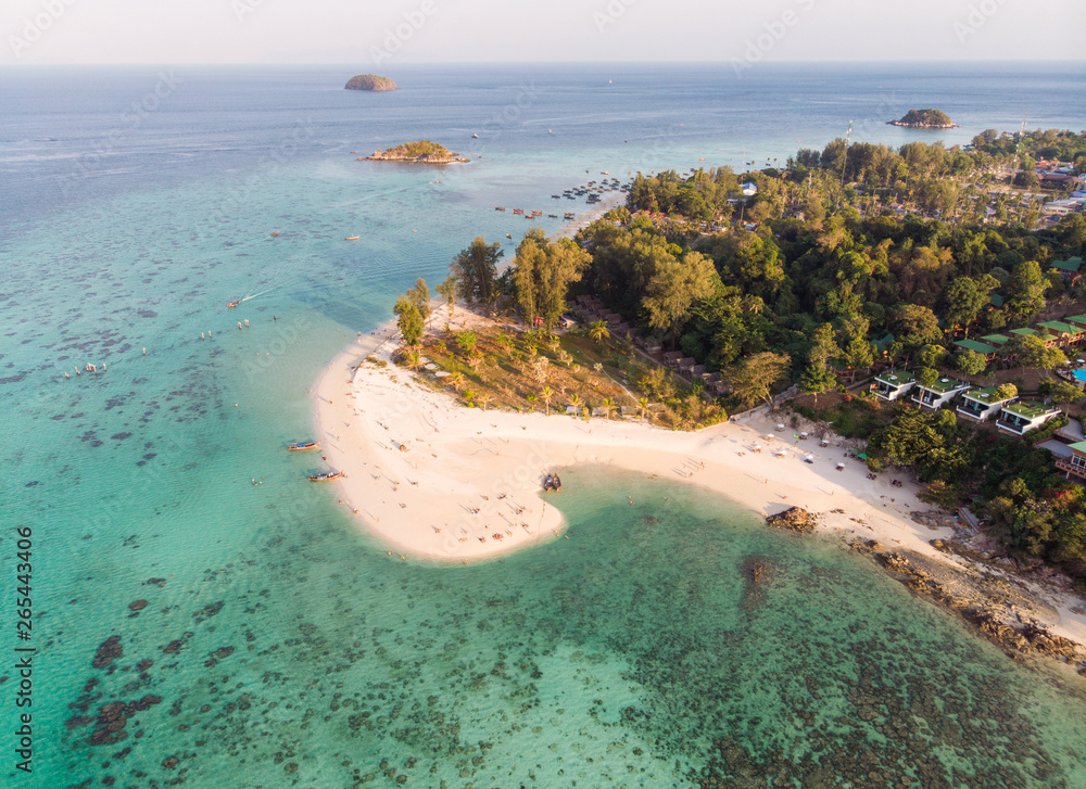 Karma white beach in emerald tropical sea at lipe island