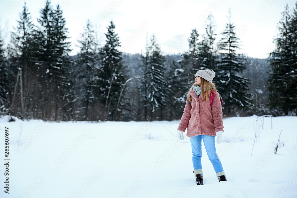 Beautiful woman at snowy resort