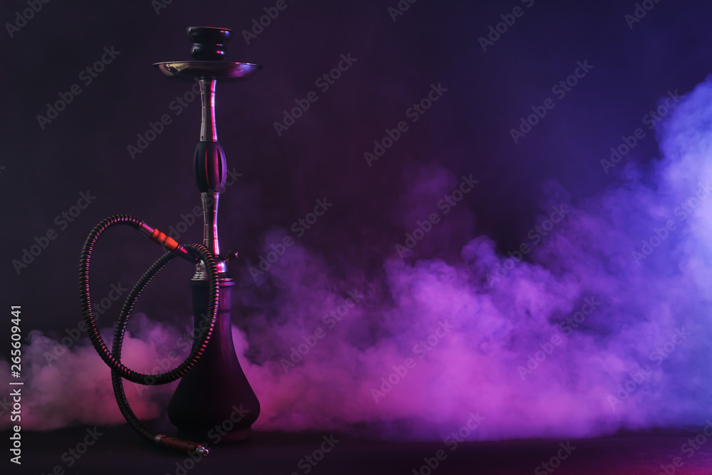 Hookah with fume on dark background