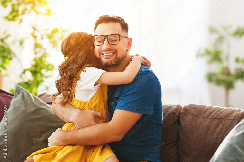 Fathers day. Happy family daughter hugs his dad