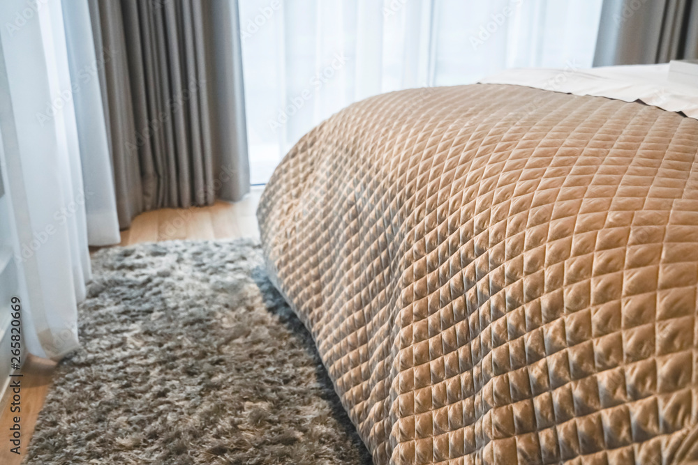 close up soft bed blanket and fur carpet rug near window bedroom