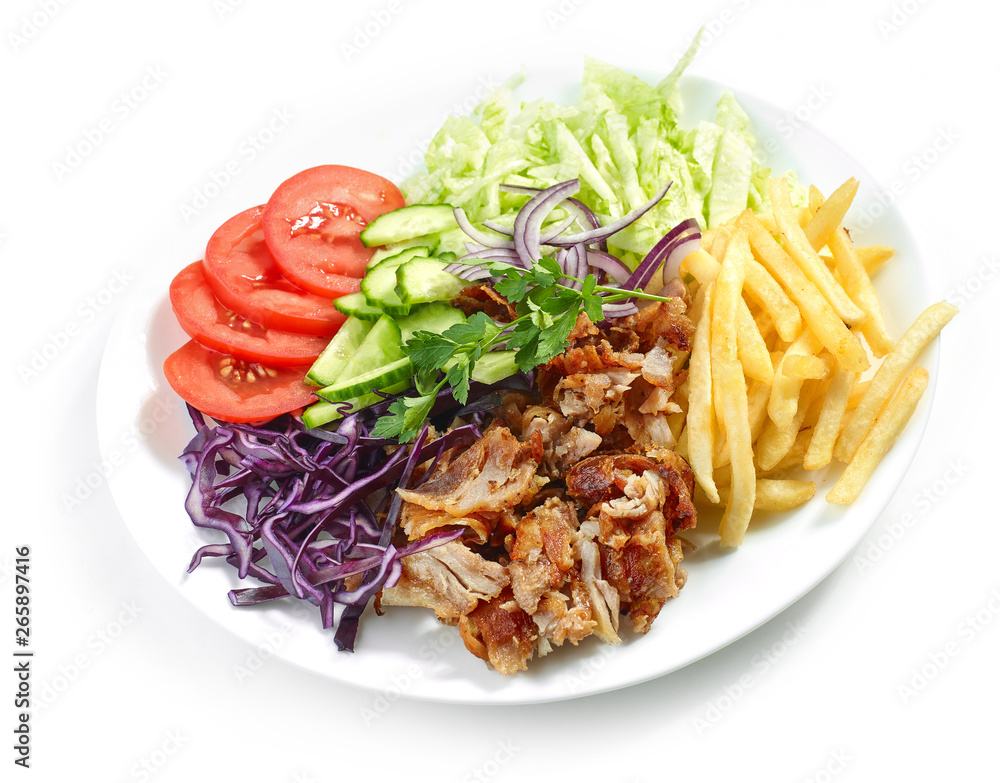 plate of chicken kebab and vegetables