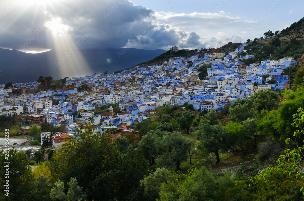 The blue city Chefchaouen/City view of the blue city Chefchaouen with dramatic sky, Morocco, Africa.