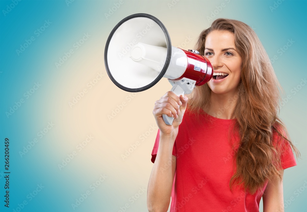 Portrait of woman holding megaphone, dressed in pin-up style