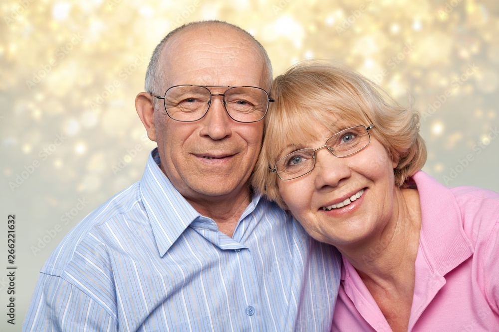 Portrait of happy senior couple smiling at home