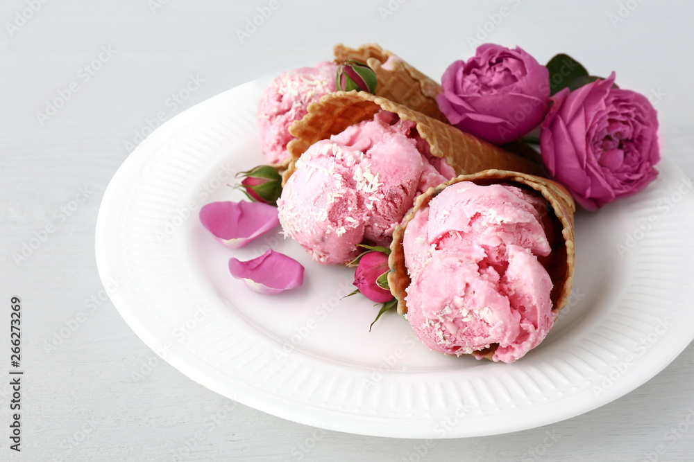 Plate with tasty ice cream on white table