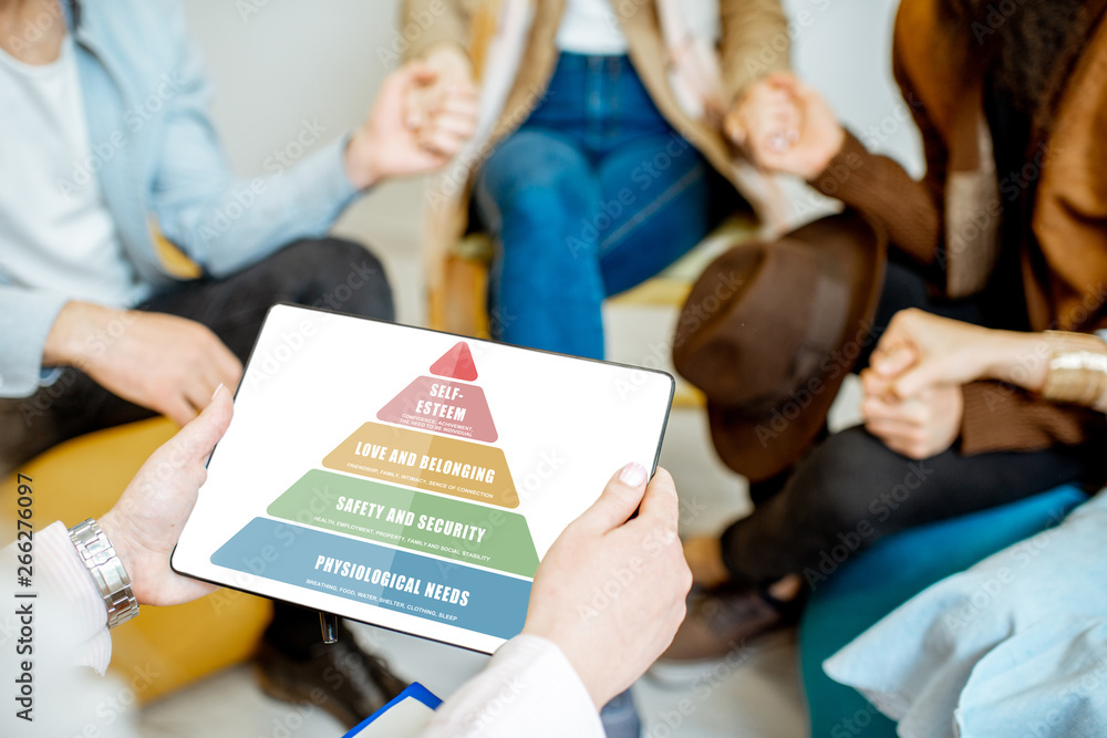 People holding digital tablet with mental pyramid sheme during the psychological therapy, close-up