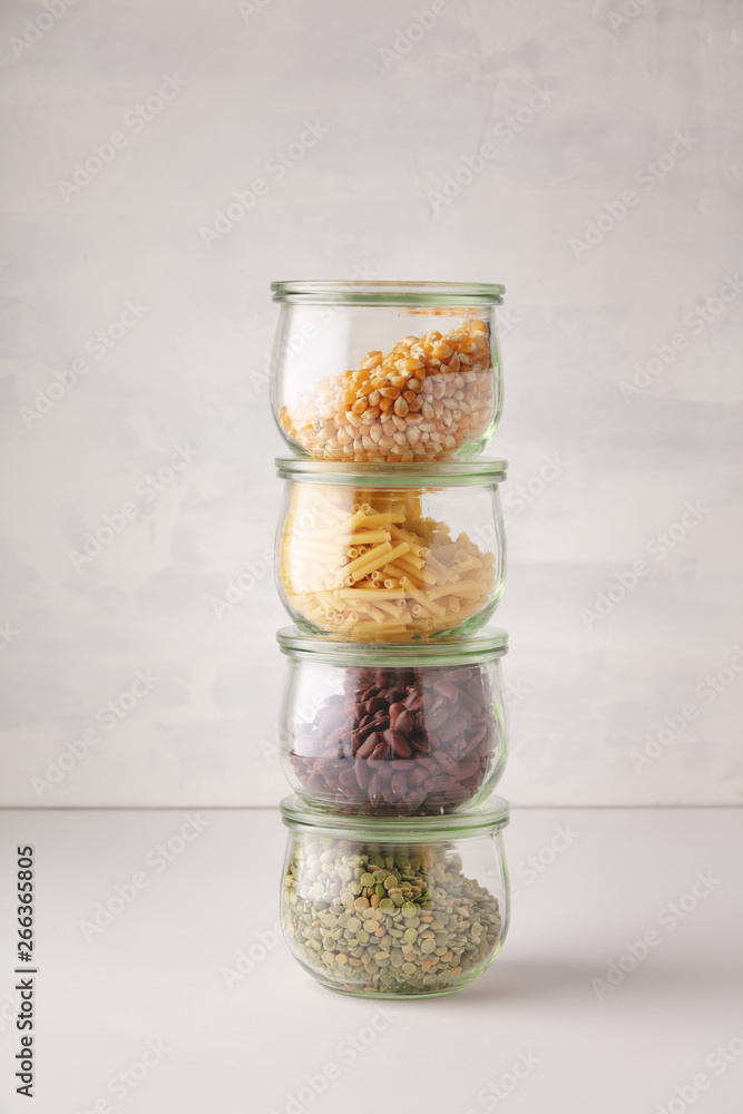 glass jars with pasta, lentils, beans and corn