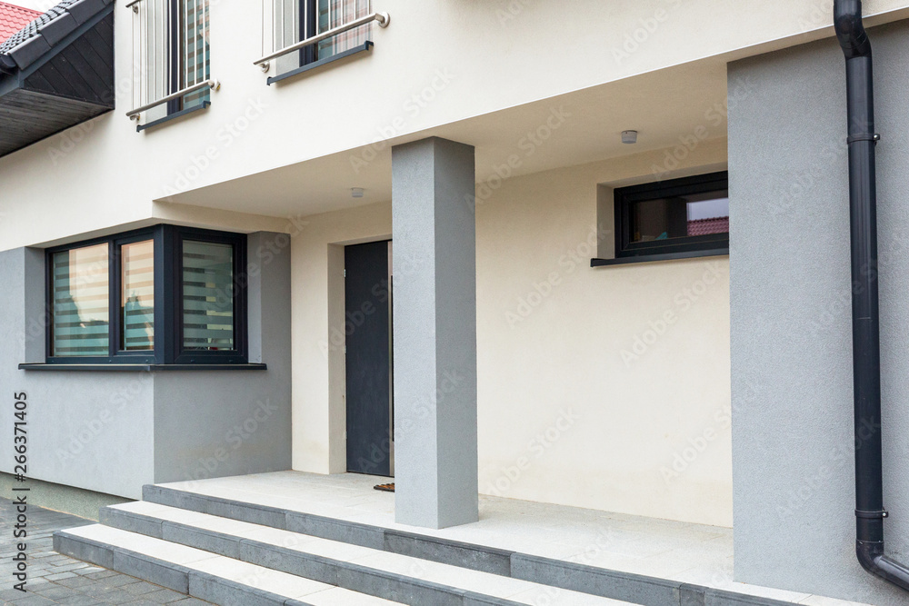 House with new laid concrete paver blocks and steps