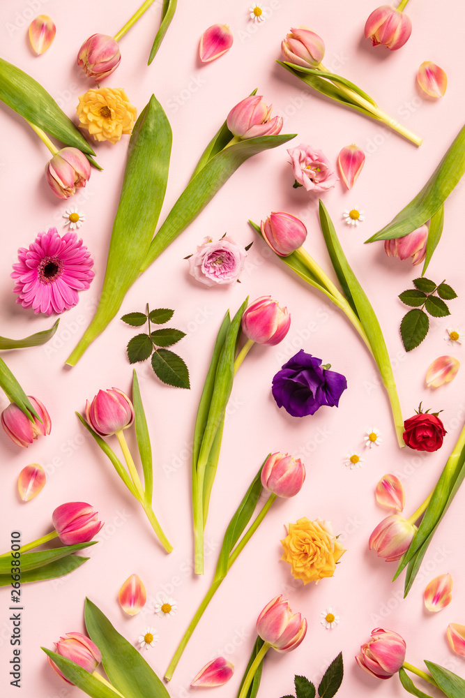 Floral pattern with pink tulips, flowers and leaves on pink back