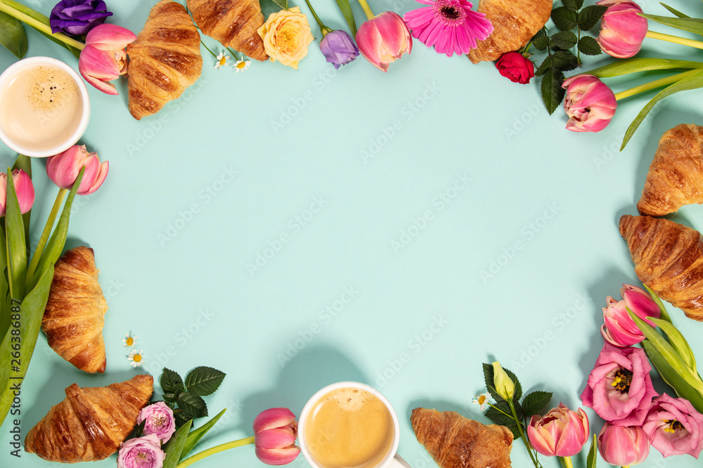 Morning coffee, croissants and a beautiful flowers. Flat lay