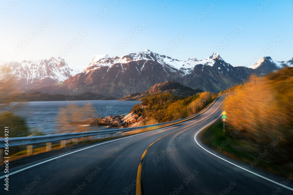 Road in mountainous Lofoten landscape with motion blur effect