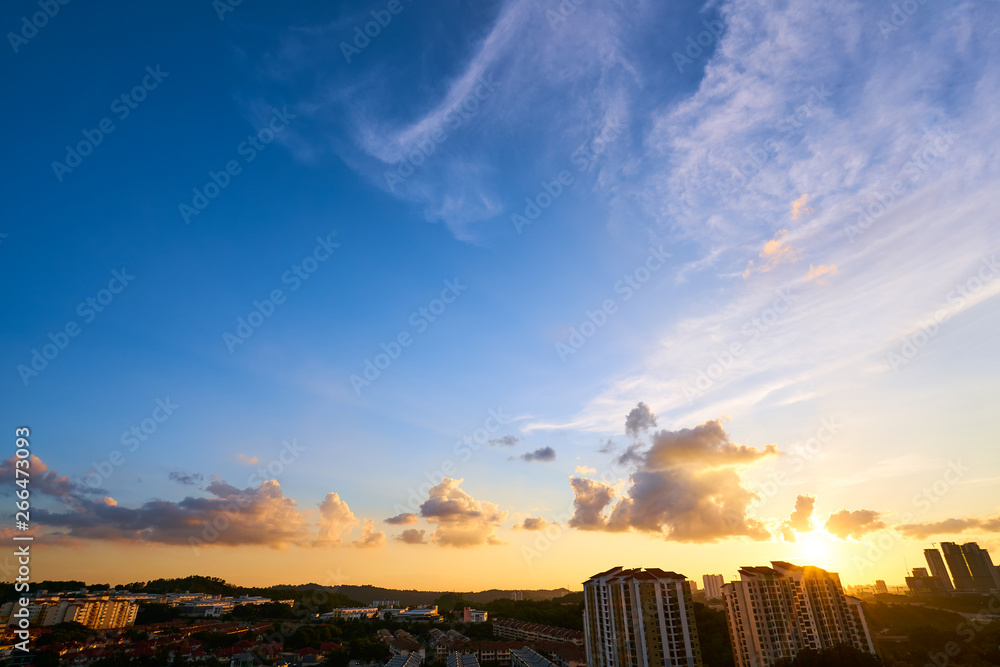 wide angle beautiful sunset sky with silhouette city skyline