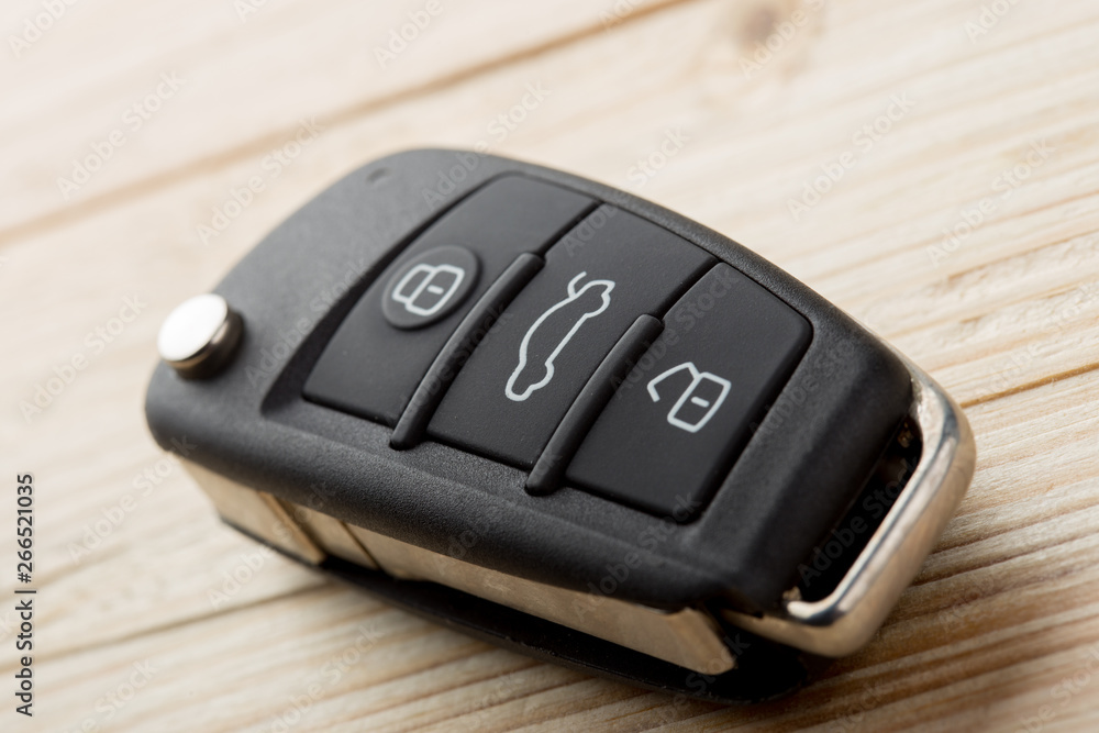 Car key and security remote on the table, concept for rent or buy a new car