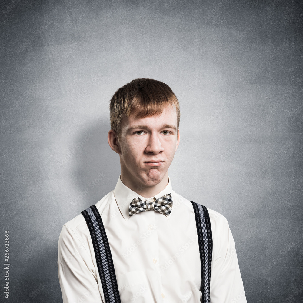 Unhappy young man looking at camera