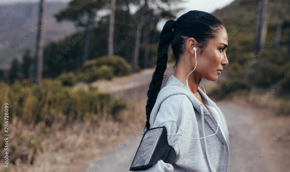 Sporty woman resting after running workout