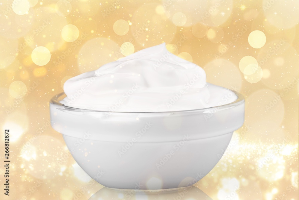 close up of a white beauty cream or yogurt on white background with clipping path