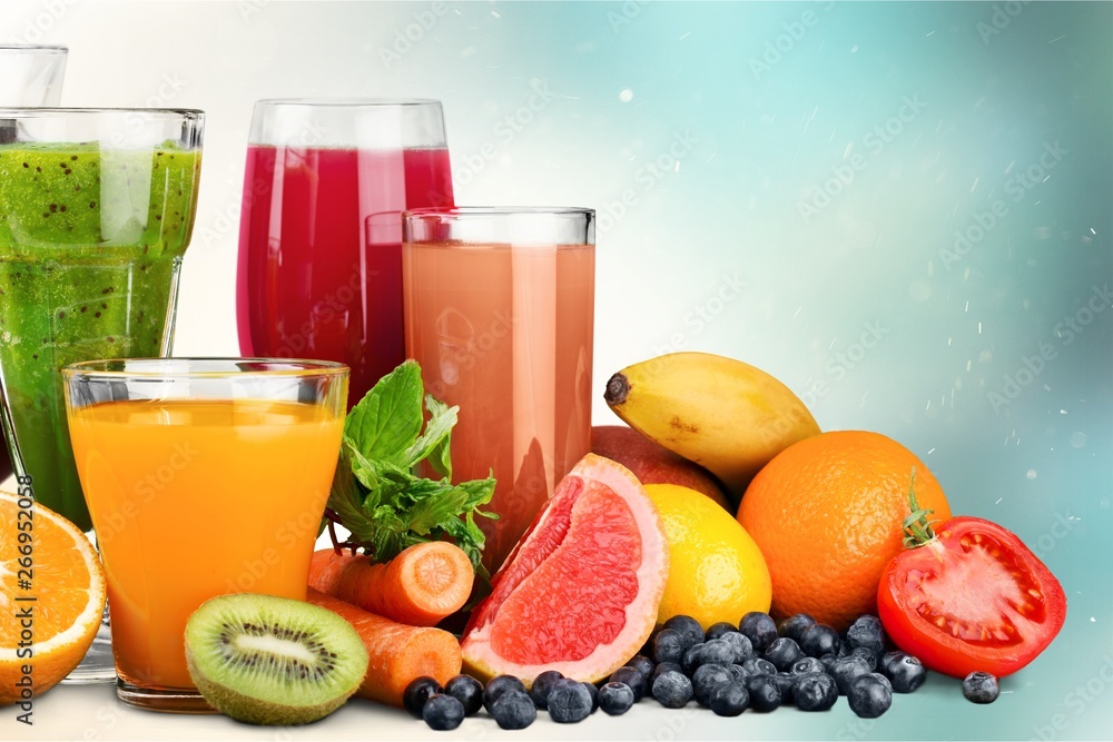 Fresh ripe healthy fruits and juices in glasses