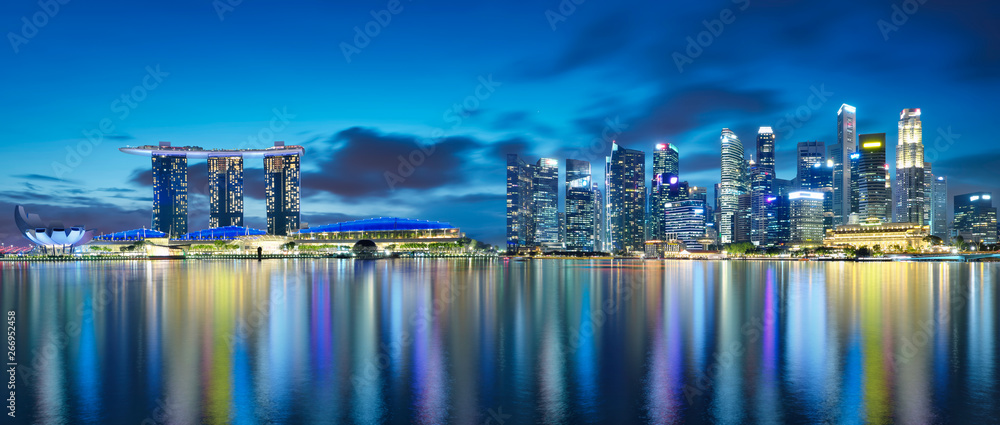 Panorama view of Singapore city skyline at night . Travel asia concept .