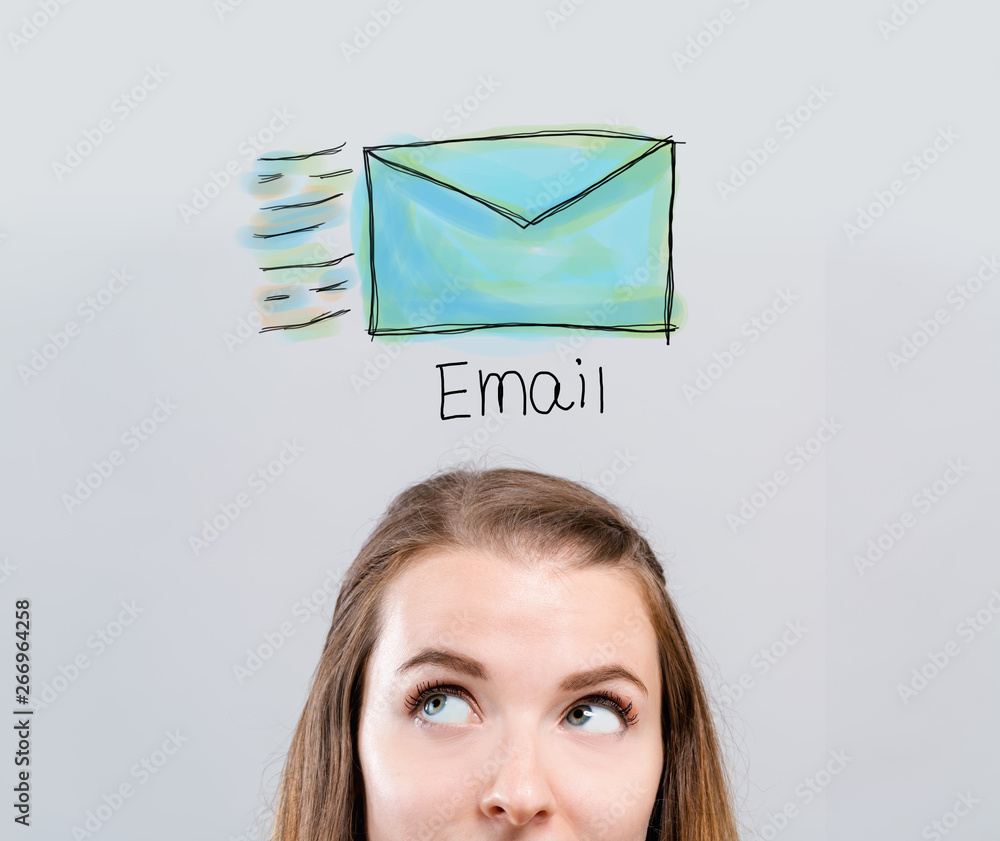 Email with young woman looking upwards on a gray background