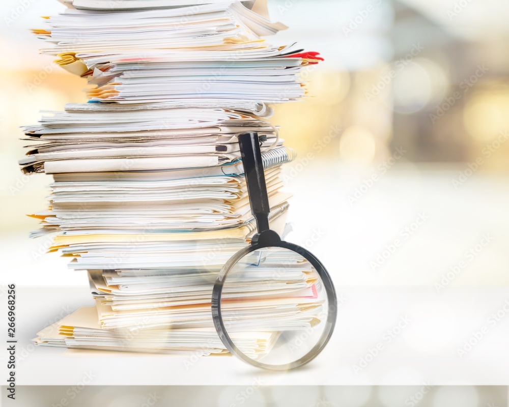 Stack of Documents / Files with Magnifying Glass