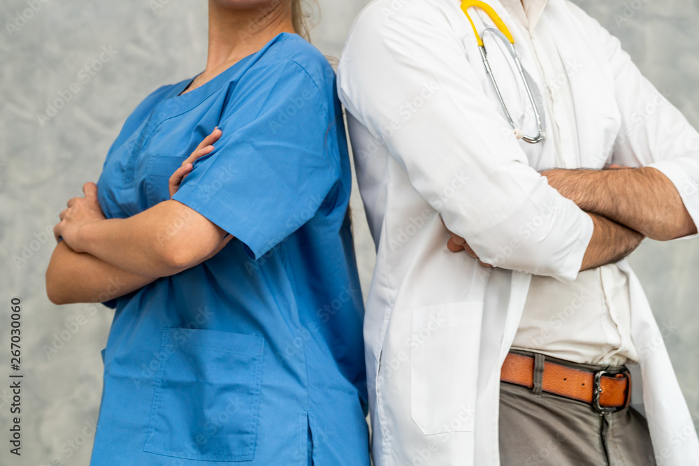 Doctor and nurse working in hospital. Healthcare and medical staff service concept.