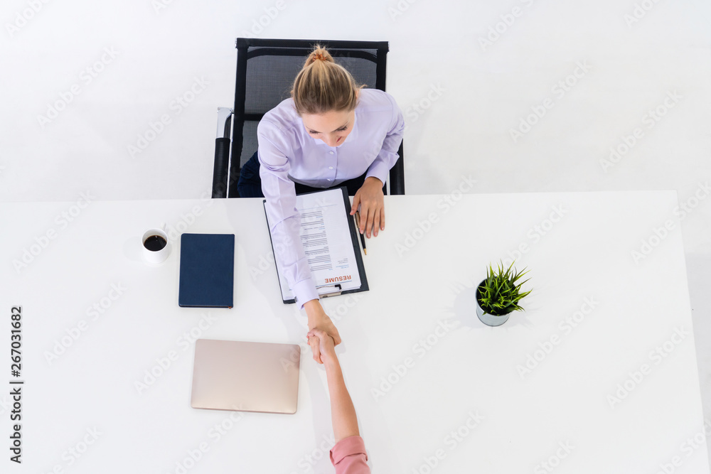 Two young business women in meeting at office table for job application and business agreement. Recr