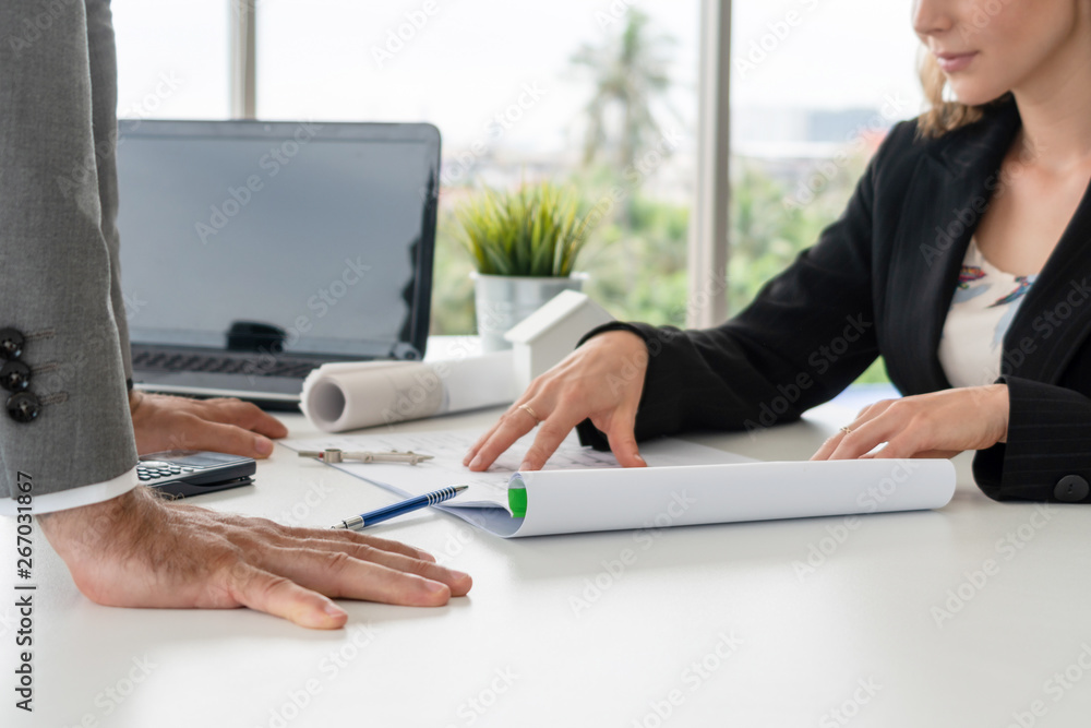 Architect and engineer working with construction drawing project on table in office. Architecture an