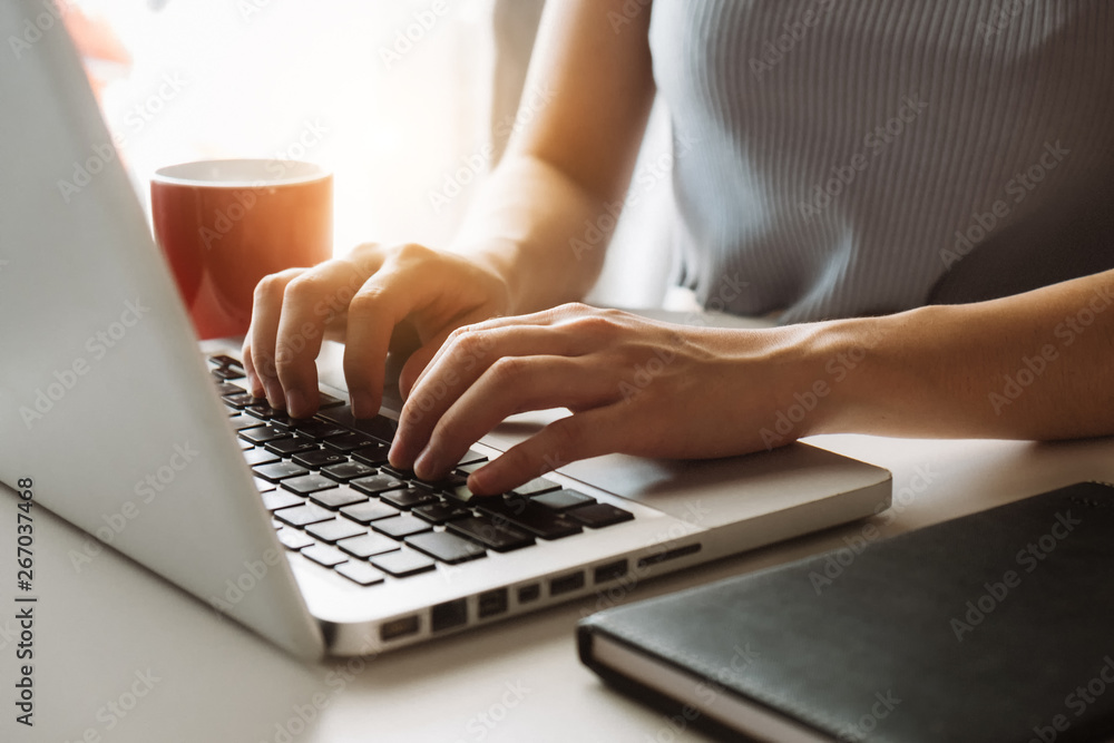 Social media and Marketing virtual icons screen of businesswoman typing keyboard with laptop compute