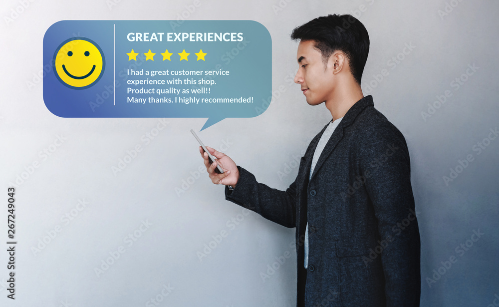 Customer Experience Concept. Young Businessman Reading a Positive Review via Smartphone. Online Sati