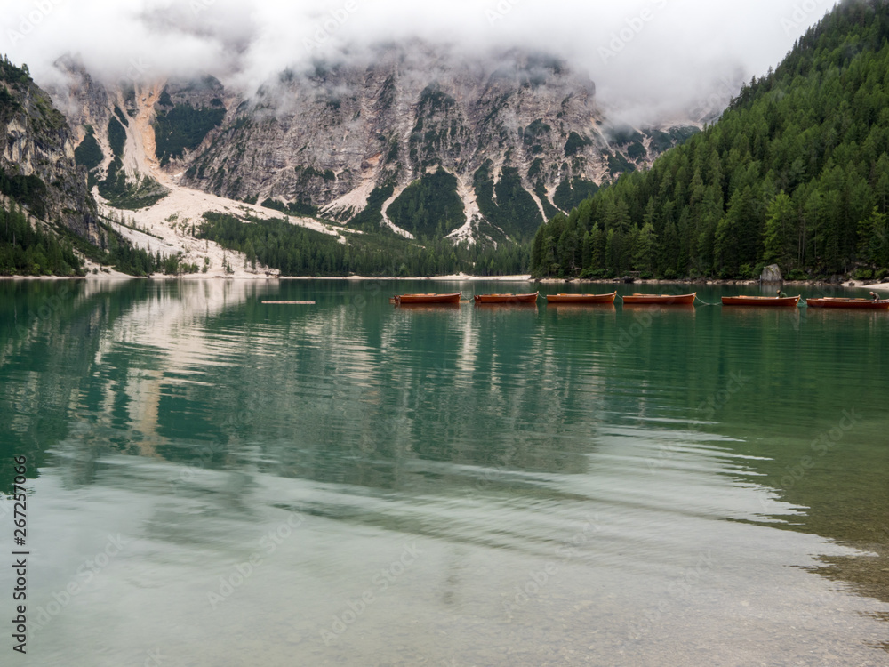 Amazing romantic place with typical wooden boats on the alpine lake,(Lago di Braies) Braies lake,Dol